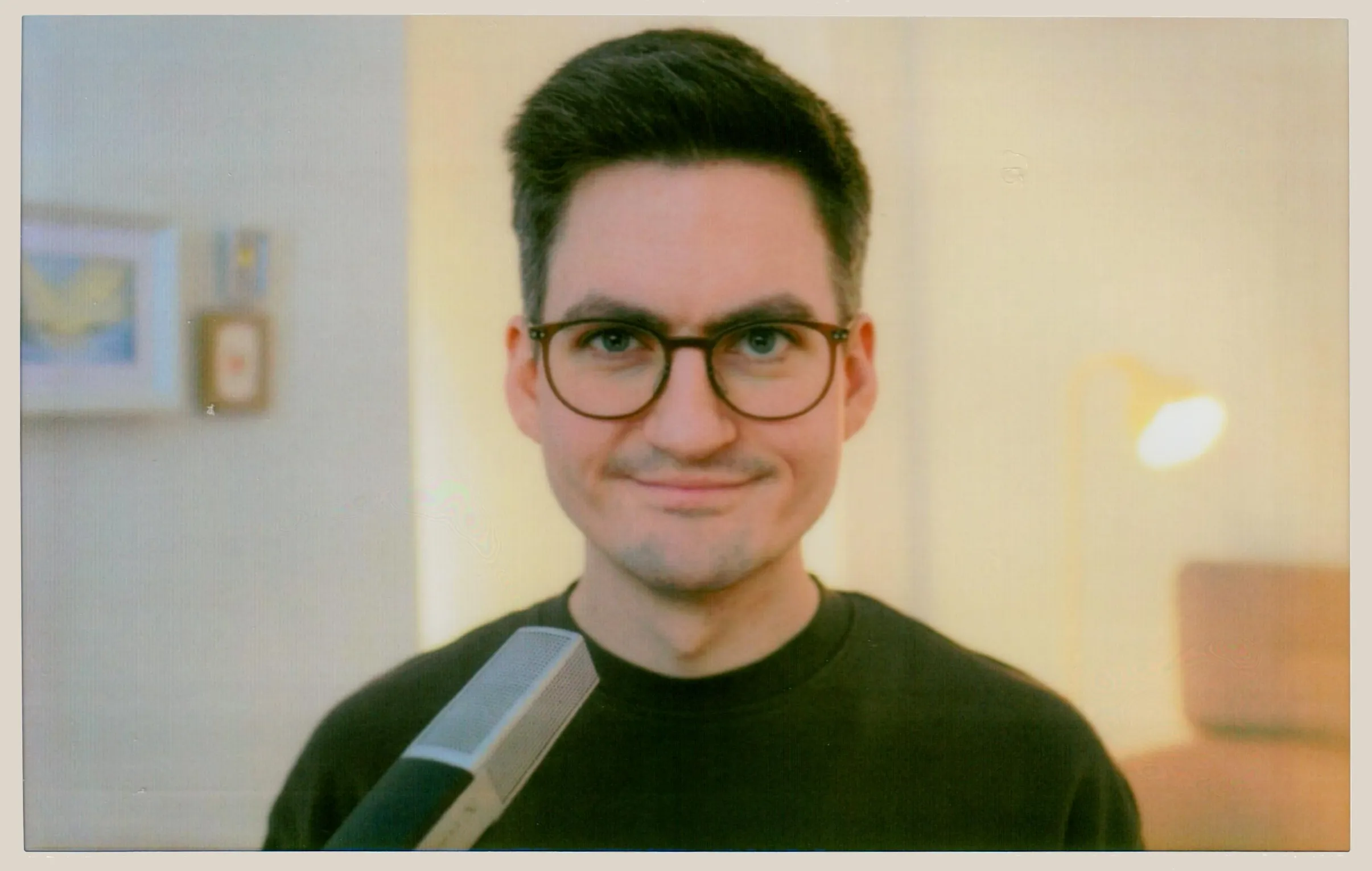 Remote working view of my workspace. Wall art painted by <a href='//instagram.com/_anne_malt/'>Anne Heller</a>. All photos shown are scans of physical Instax Wide Evo prints.