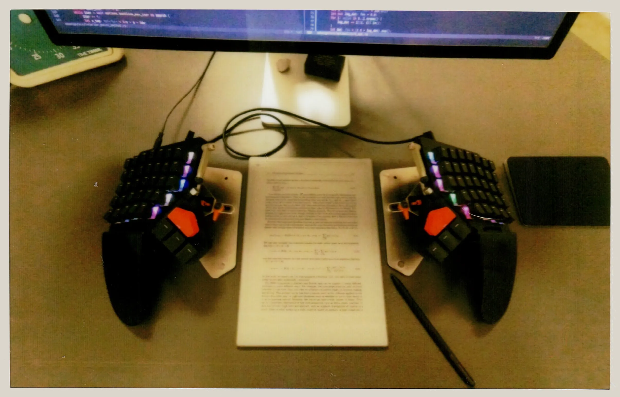 Splitted keyboard with reMarkable paper pro in portrait mode. All photos shown are scans of physical Instax Wide Evo prints.